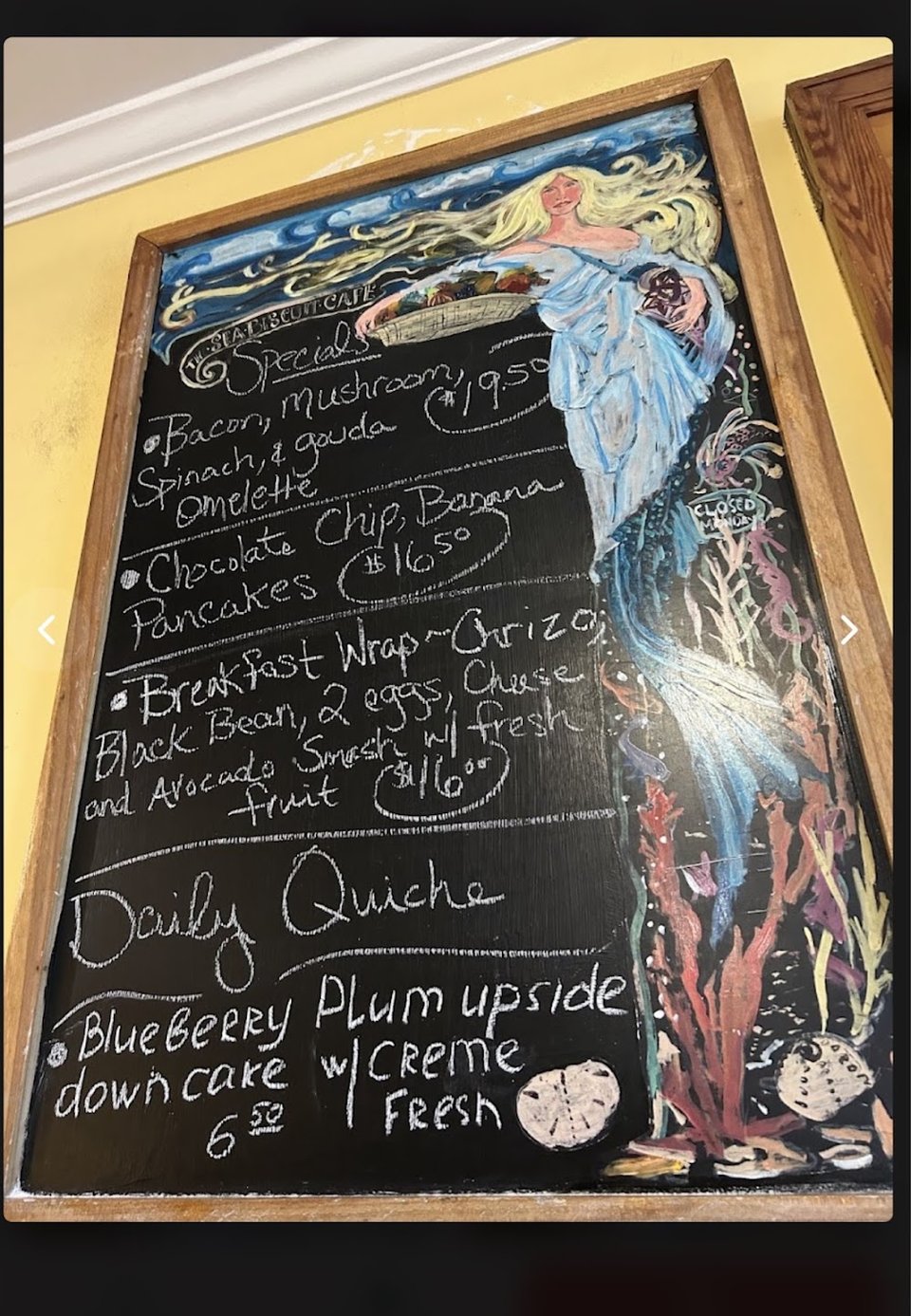 Printed menu showing fruit plates and biscuits.